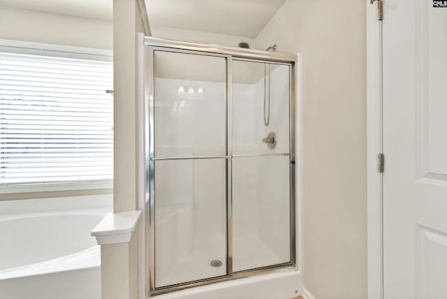 full bathroom with a garden tub and a stall shower