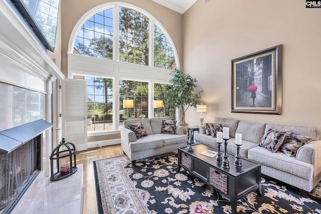 212 Cartgate Cir, Blythewood, SC 29016 - living room with plenty of natural light, ornamental molding, a towering ceiling, and wood finished floors