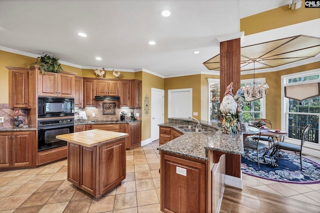212 Cartgate Cir, Blythewood, SC 29016 - kitchen featuring wood counters, black appliances, ornamental molding, and a sink