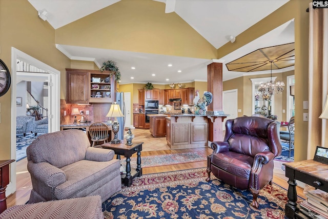 212 Cartgate Cir, Blythewood, SC 29016 - living area featuring lofted ceiling, recessed lighting, crown molding, a notable chandelier, and light wood-style floors