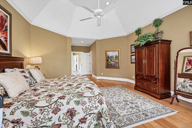 212 Cartgate Cir, Blythewood, SC 29016 - bedroom with light wood-style floors, vaulted ceiling, baseboards, and ornamental molding