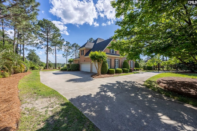 212 Cartgate Cir, Blythewood, SC 29016 - view of front of house with an attached garage, brick siding, and driveway