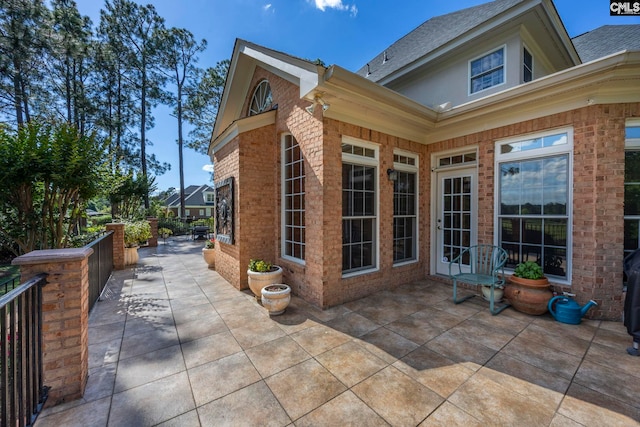 212 Cartgate Cir, Blythewood, SC 29016 - rear view of house featuring a patio area, brick siding, and roof with shingles