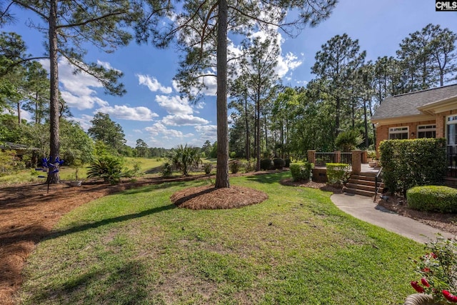 212 Cartgate Cir, Blythewood, SC 29016 - view of green lawn with a wooden deck