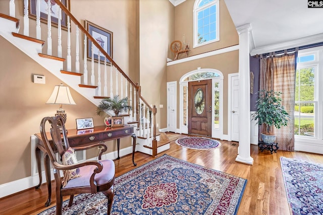 212 Cartgate Cir, Blythewood, SC 29016 - entryway with baseboards, ornate columns, and wood finished floors