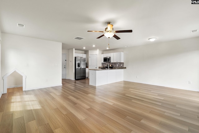 unfurnished living room with a ceiling fan, light wood finished floors, baseboards, and recessed lighting