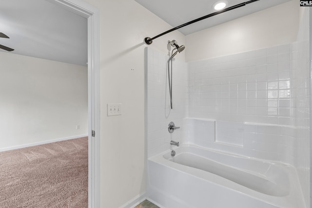 bathroom featuring baseboards, ceiling fan, and shower / bathtub combination