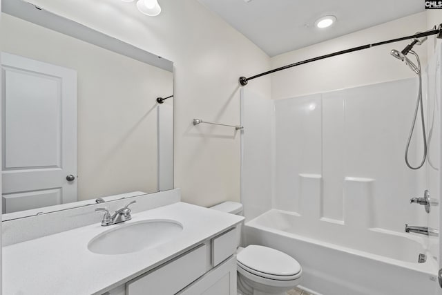 full bathroom featuring toilet, shower / washtub combination, and vanity