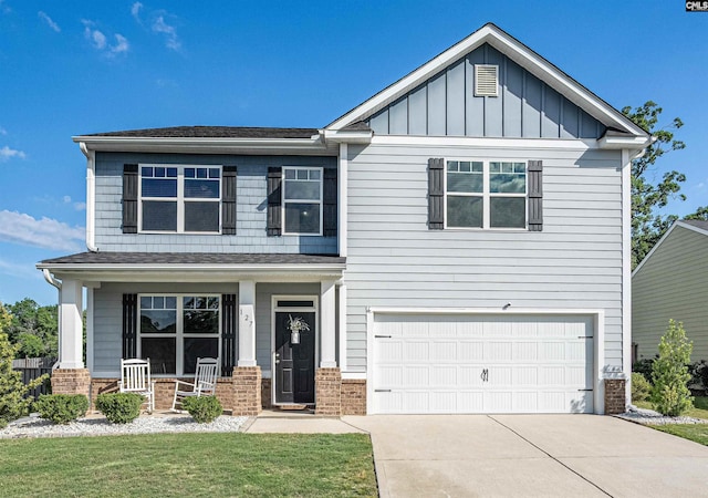 craftsman inspired home with brick siding, a porch, driveway, an attached garage, and board and batten siding