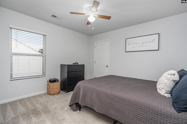 bedroom with carpet flooring, ceiling fan, and baseboards