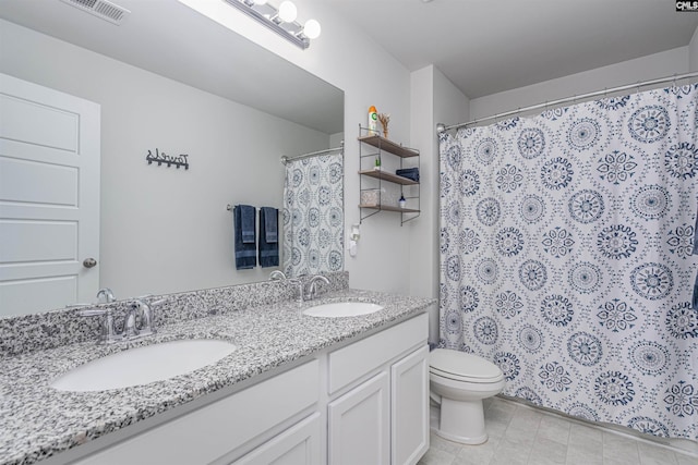 full bathroom with toilet, double vanity, and curtained shower