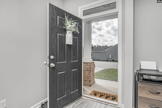entryway with wood finished floors