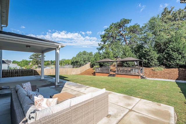 view of patio / terrace featuring a gazebo, outdoor lounge area, and a wooden deck