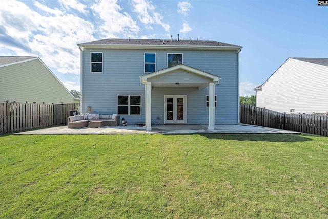 back of property with french doors, an outdoor hangout area, and a patio area