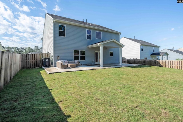 back of house with outdoor lounge area and a patio area