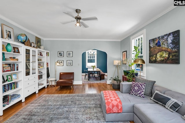 307 Waccamaw Ave, Columbia, SC 29205 - living room featuring arched walkways, ornamental molding, a ceiling fan, wood finished floors, and baseboards