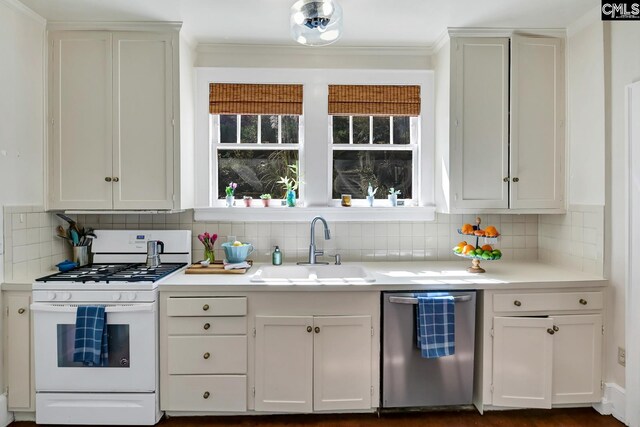 307 Waccamaw Ave, Columbia, SC 29205 - kitchen with white range with gas cooktop, dishwasher, a sink, decorative backsplash, and crown molding