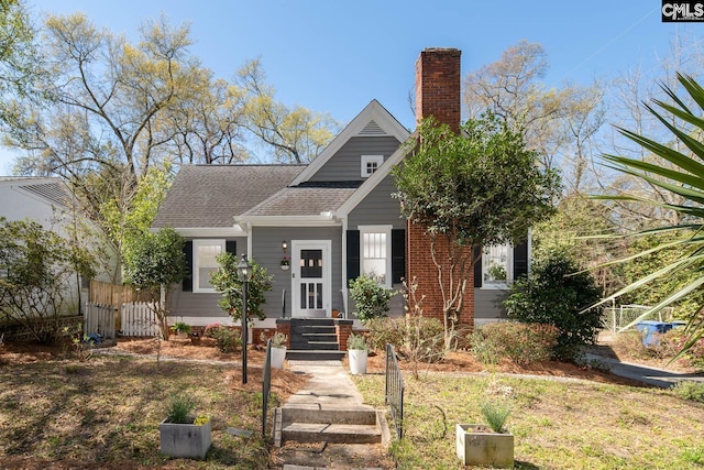 307 Waccamaw Ave, Columbia, SC 29205 - bungalow-style house featuring a shingled roof, a chimney, and fence