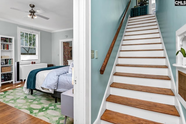 307 Waccamaw Ave, Columbia, SC 29205 - stairway with radiator, wood finished floors, ornamental molding, and ceiling fan