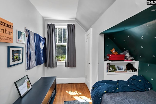 307 Waccamaw Ave, Columbia, SC 29205 - bedroom featuring vaulted ceiling, wood finished floors, and baseboards
