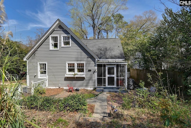 307 Waccamaw Ave, Columbia, SC 29205 - back of property with roof with shingles, fence, a sunroom, and entry steps