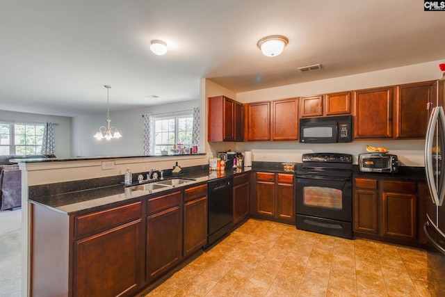 393 Vermillion Dr, Columbia, SC 29209 - kitchen featuring black appliances, a sink, a peninsula, open floor plan, and a chandelier