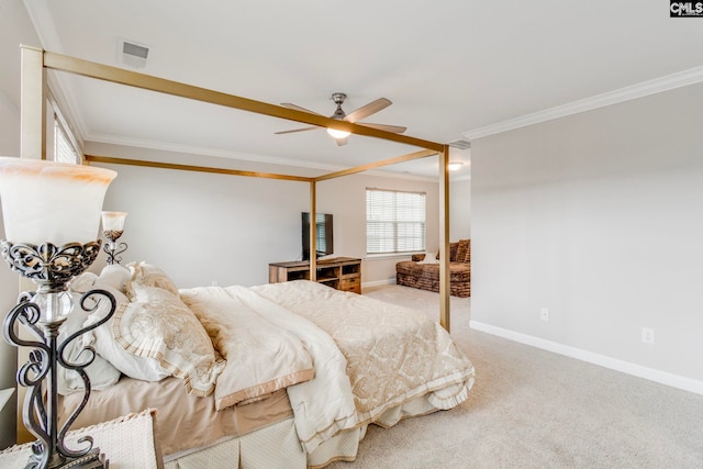 carpeted bedroom with crown molding, baseboards, and ceiling fan