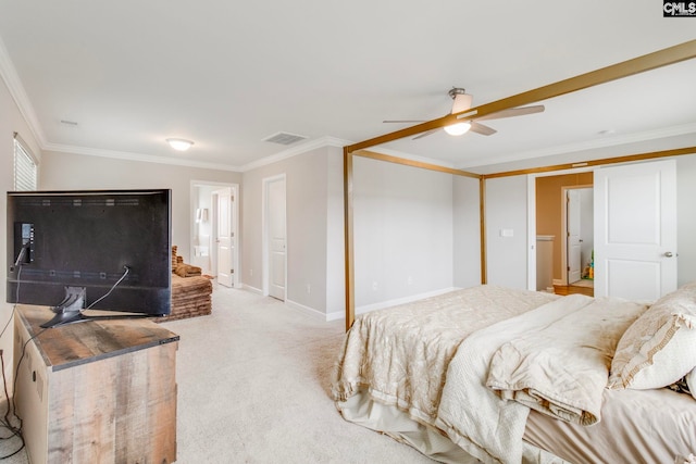 carpeted bedroom featuring ornamental molding, baseboards, and a ceiling fan