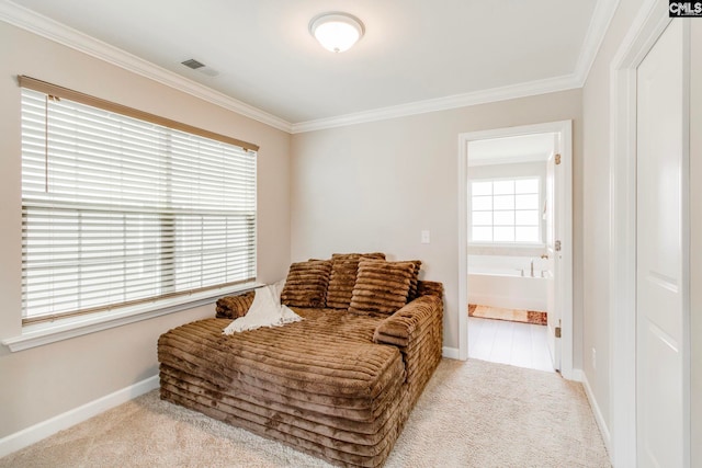 living area featuring crown molding, carpet floors, and baseboards