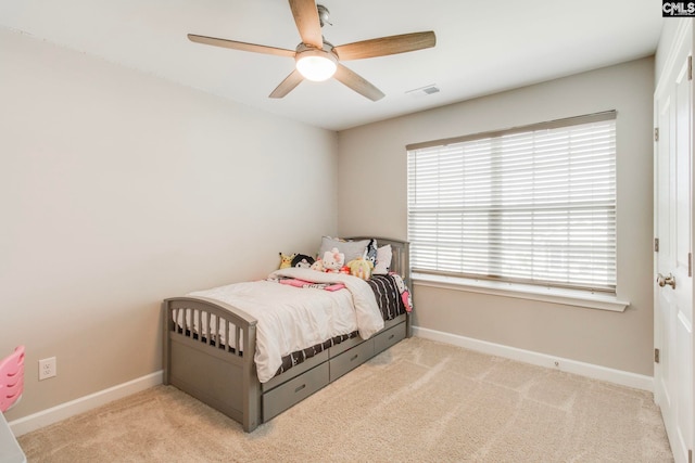 bedroom with carpet, baseboards, and ceiling fan