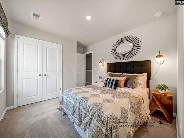 carpeted bedroom with a closet, baseboards, and recessed lighting