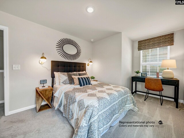 carpeted bedroom featuring baseboards