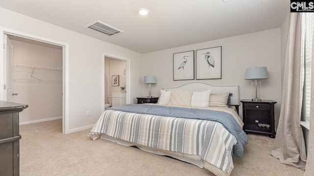 119 Shumard Ct, Columbia, SC 29203 - bedroom with carpet floors, a walk in closet, baseboards, connected bathroom, and a closet