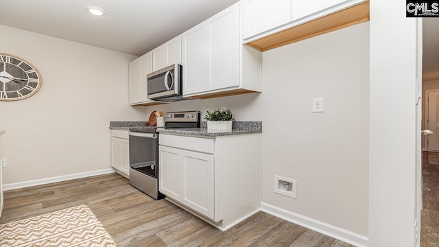 119 Shumard Ct, Columbia, SC 29203 - kitchen with appliances with stainless steel finishes, light wood-type flooring, baseboards, white cabinets, and light stone countertops