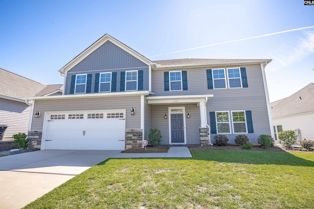 craftsman-style home featuring a front yard, driveway, an attached garage, board and batten siding, and stone siding