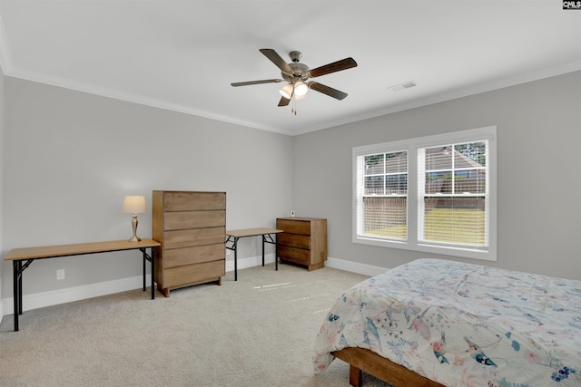 bedroom featuring crown molding, baseboards, carpet, and a ceiling fan