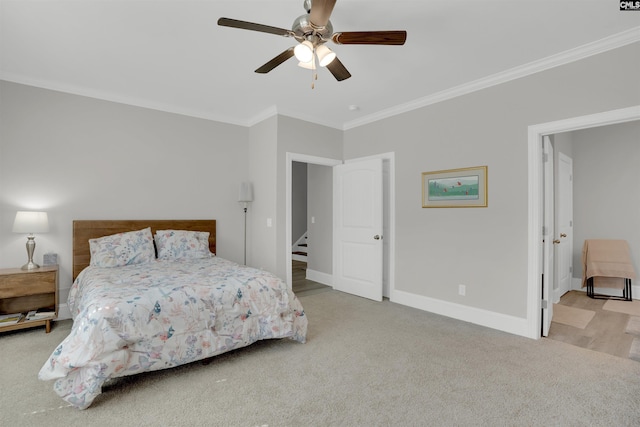 bedroom featuring crown molding, carpet, baseboards, and ceiling fan