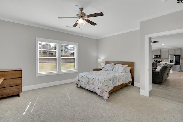 bedroom with stainless steel fridge, crown molding, baseboards, light colored carpet, and ceiling fan