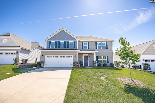 view of front of house featuring driveway, a front lawn, a garage, and stone siding