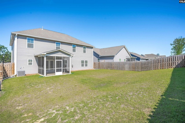 back of property with cooling unit and a sunroom