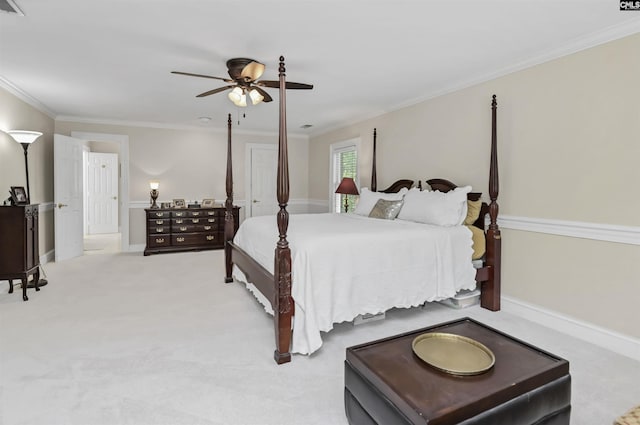 bedroom with ornamental molding, carpet flooring, a ceiling fan, and baseboards