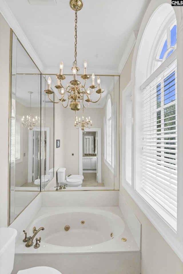 full bathroom with a chandelier, a tub with jets, and toilet