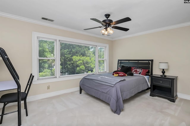 bedroom featuring baseboards, ornamental molding, light carpet, and ceiling fan