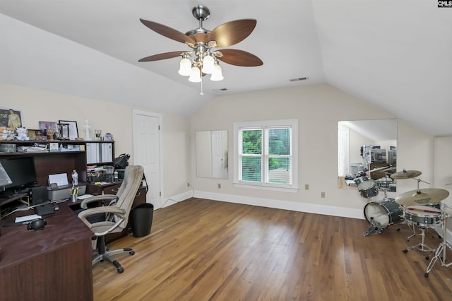 office space with lofted ceiling, wood finished floors, ceiling fan, and baseboards
