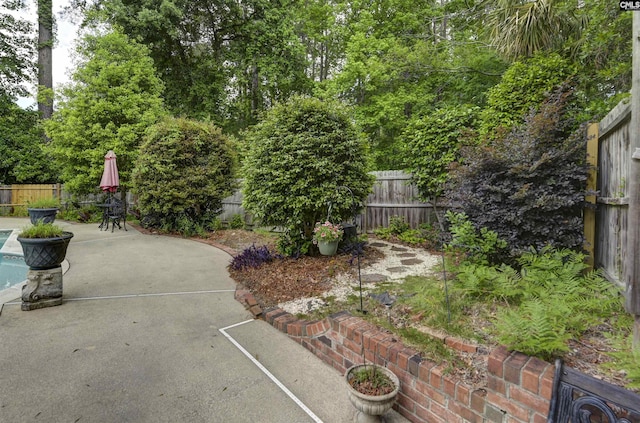 fenced backyard featuring a patio area