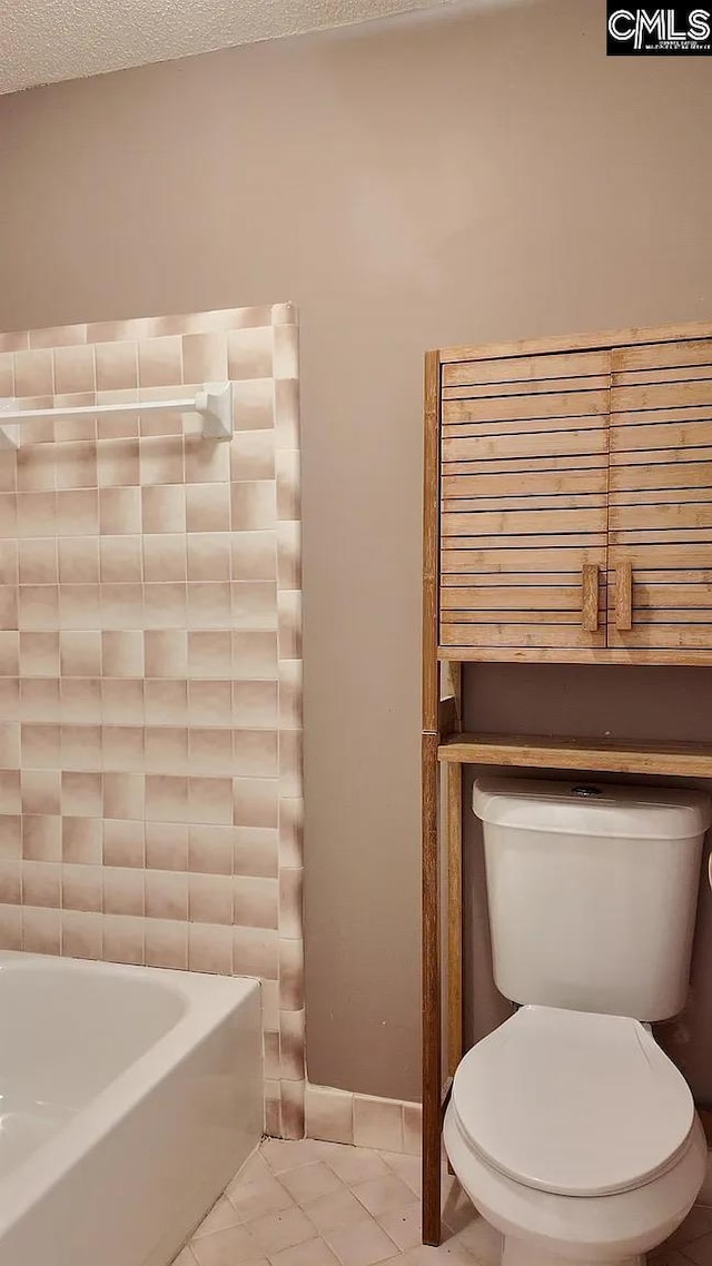 full bathroom with toilet and a tub