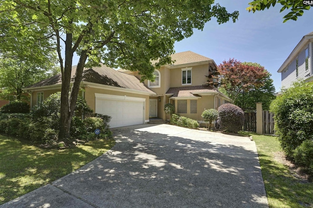 10 N Sweetbriar Ln, Columbia, SC 29223 - traditional-style home featuring stucco siding, driveway, an attached garage, and fence
