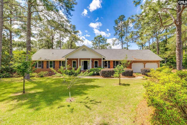 single story home with brick siding, an attached garage, a front yard, and roof with shingles