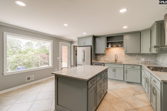 kitchen featuring stainless steel appliances, gray cabinetry, decorative backsplash, crown molding, and recessed lighting