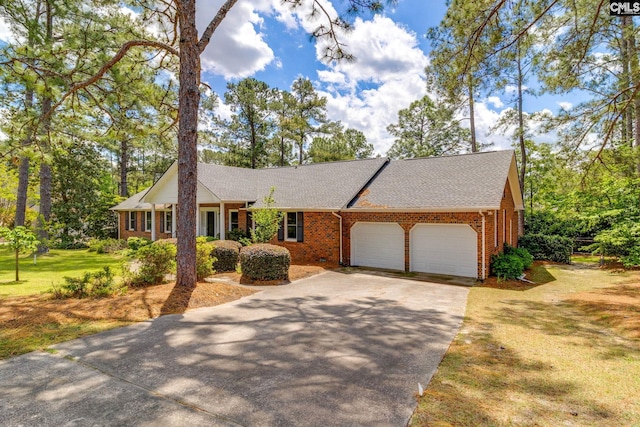 ranch-style home featuring an attached garage, brick siding, driveway, a front lawn, and a shingled roof